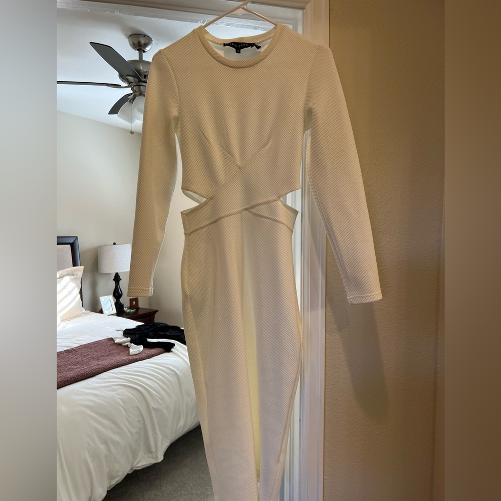 The fifth dress- long sleeves, white with stylish side cutouts. Midi length.